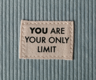 Soft velvety fabric with a stitched square patch that reads “You are your only limit,” symbolizing confidence and self-belief.