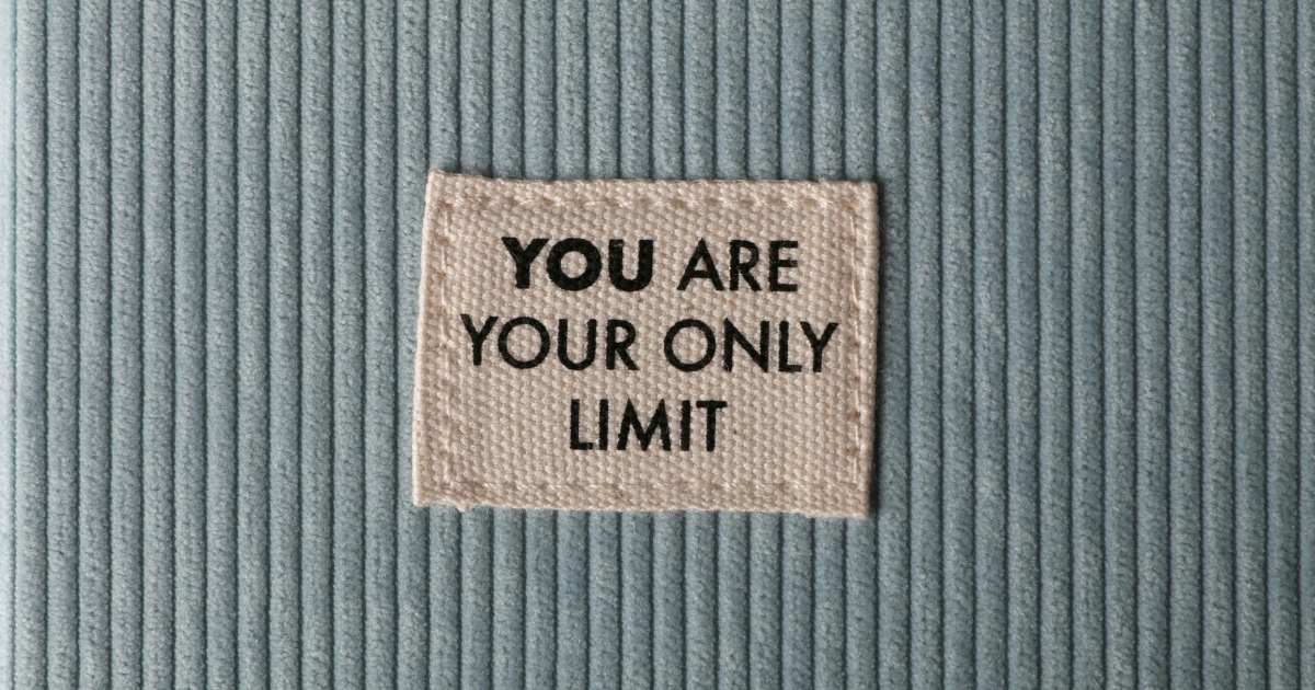 Soft velvety fabric with a stitched square patch that reads “You are your only limit,” symbolizing confidence and self-belief.